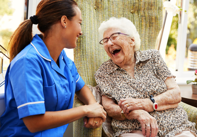 nurse and patient laughing
